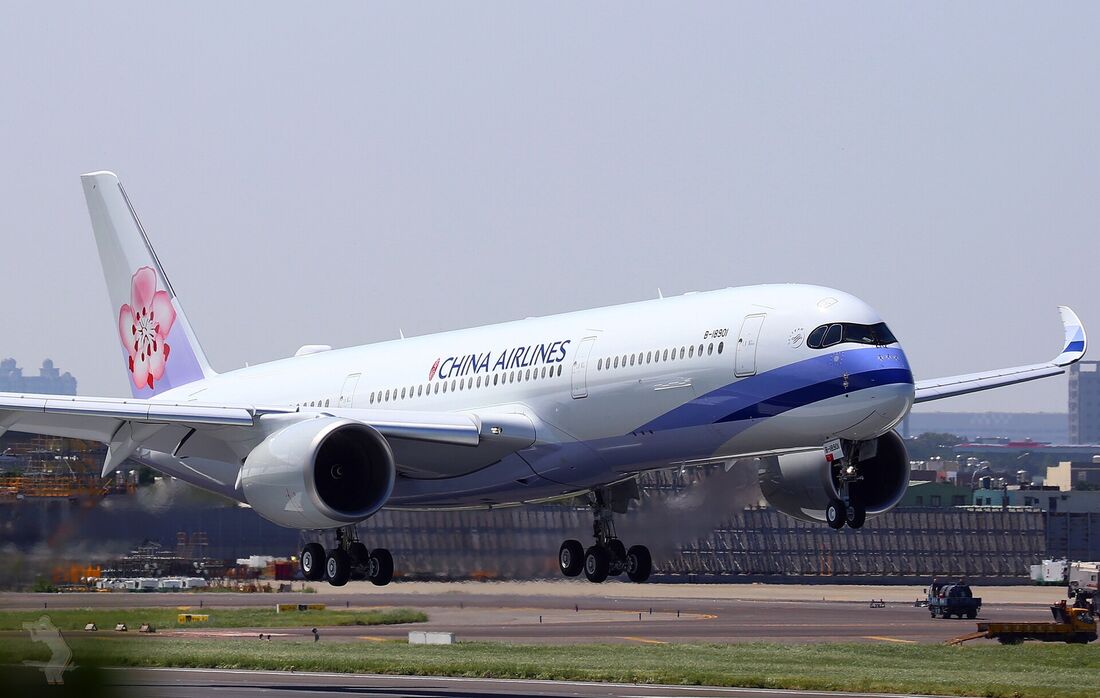 A China Airlines Airbus A350 lifting off, showing the dark panel around its cockpit windows and a curved upswept wingtip